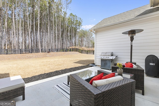 view of patio with a fenced backyard and a grill