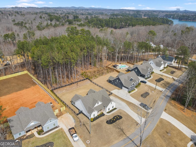 aerial view featuring a wooded view