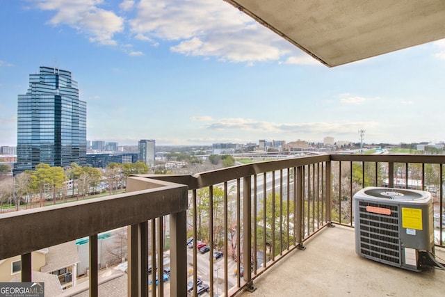 balcony with central air condition unit and a city view