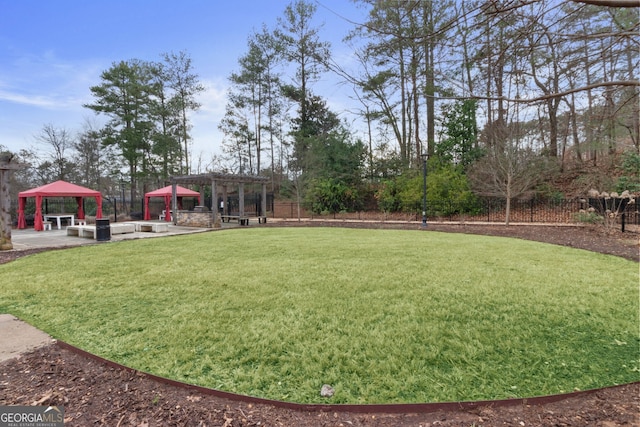 view of yard featuring a gazebo and fence