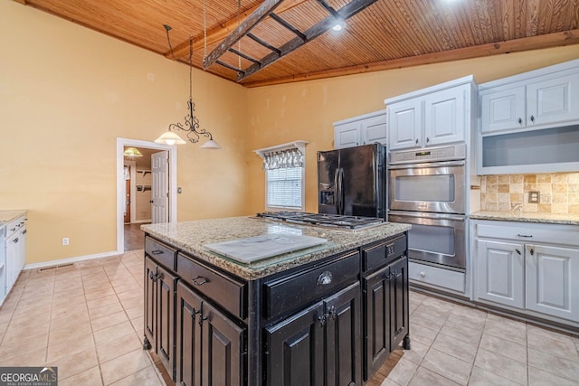 kitchen with wood ceiling, appliances with stainless steel finishes, tasteful backsplash, and light tile patterned flooring