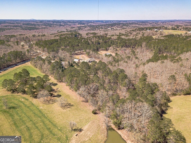 aerial view featuring a forest view