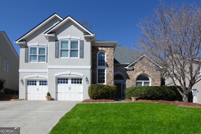 traditional home featuring a garage, stone siding, driveway, stucco siding, and a front lawn