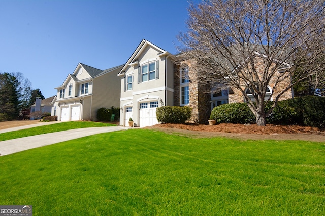 traditional home with driveway, stone siding, an attached garage, a front lawn, and stucco siding