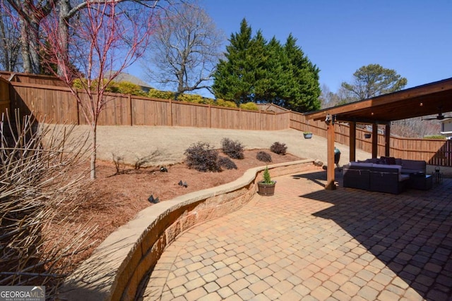 view of patio / terrace featuring a fenced backyard and an outdoor living space