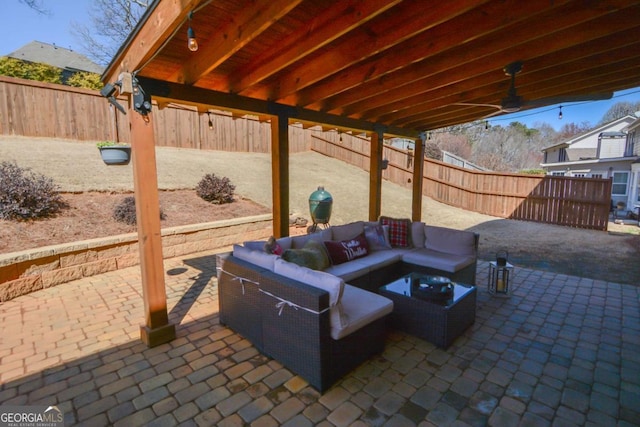 view of patio featuring a fenced backyard and outdoor lounge area