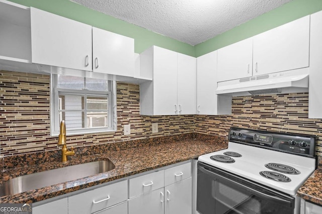 kitchen with under cabinet range hood, white cabinetry, range with electric cooktop, and a sink