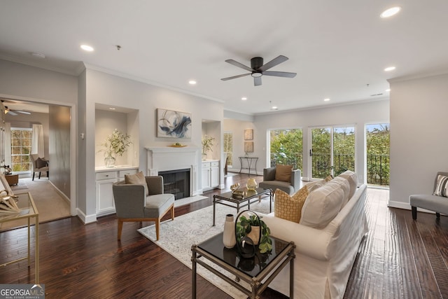 living room featuring dark wood-style floors, a fireplace with flush hearth, and baseboards