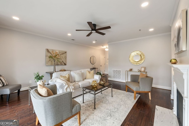 living area featuring baseboards, visible vents, dark wood-style flooring, a fireplace, and recessed lighting