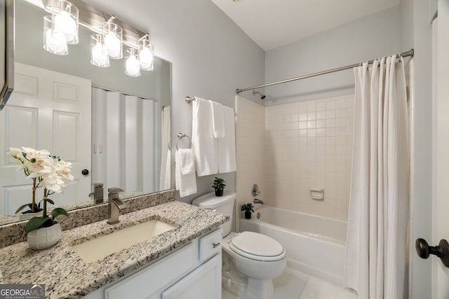 full bath with toilet, shower / bath combo with shower curtain, and vanity