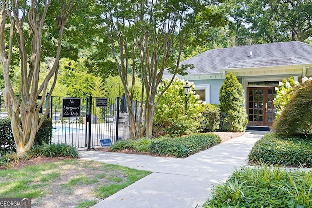 exterior space featuring fence and a gate