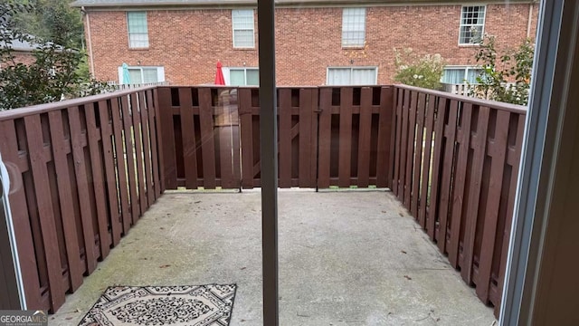 view of patio featuring a balcony