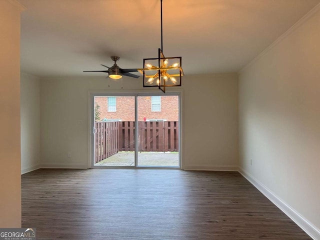 spare room featuring ceiling fan with notable chandelier, baseboards, dark wood-style flooring, and ornamental molding