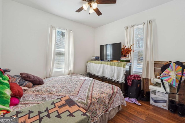 bedroom featuring ceiling fan and wood finished floors