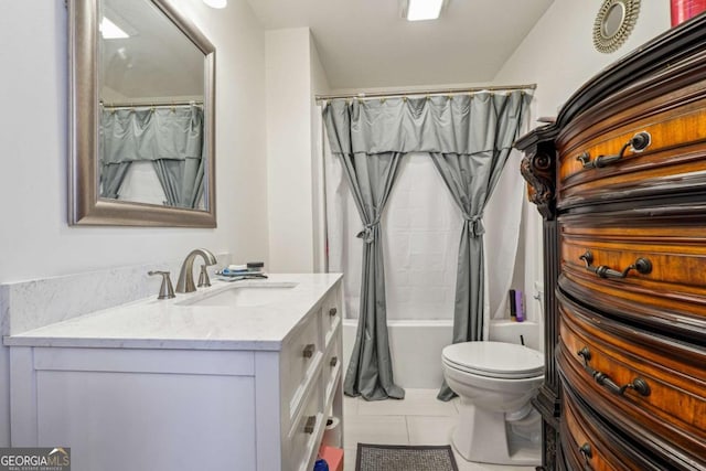 bathroom with toilet, tile patterned floors, shower / bath combo with shower curtain, and vanity