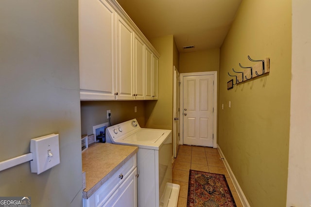 laundry area with cabinet space, light tile patterned floors, baseboards, visible vents, and washer and dryer