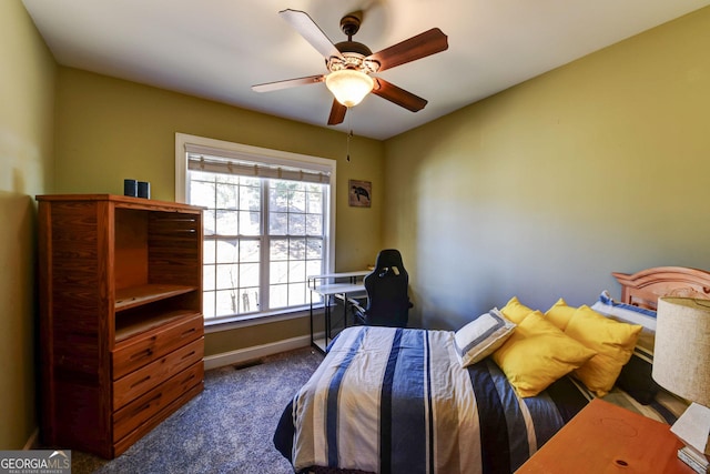 carpeted bedroom with baseboards and ceiling fan