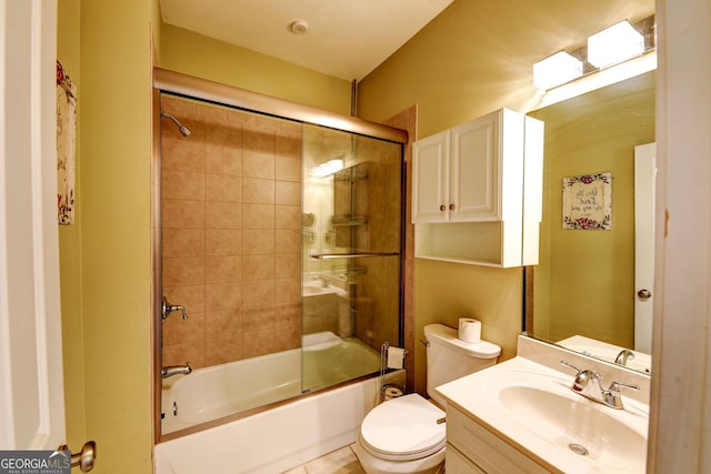 full bath featuring shower / bath combination with glass door, toilet, and vanity