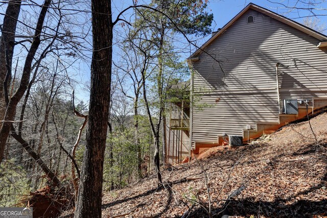 view of side of property with cooling unit