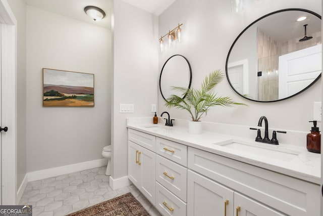 full bathroom with a sink, toilet, double vanity, and tile patterned floors