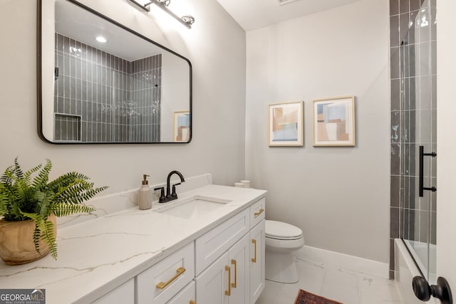 bathroom with toilet, marble finish floor, combined bath / shower with glass door, baseboards, and vanity