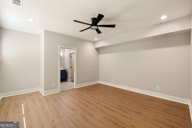 unfurnished bedroom featuring visible vents, recessed lighting, baseboards, and wood finished floors