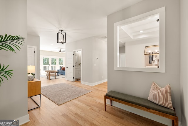 interior space featuring baseboards and wood finished floors