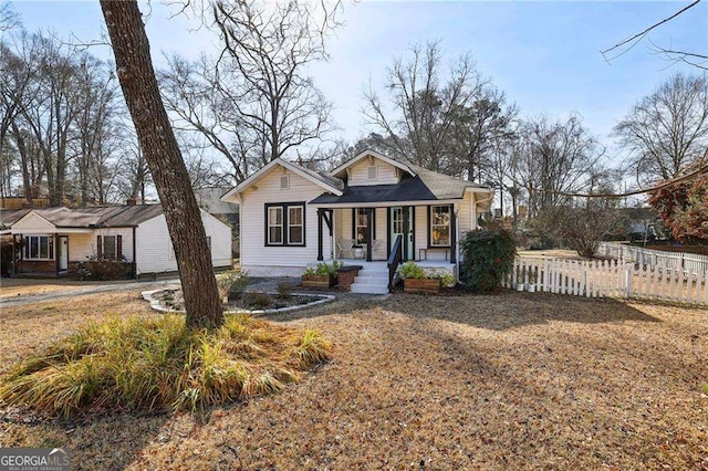 bungalow with fence and a porch