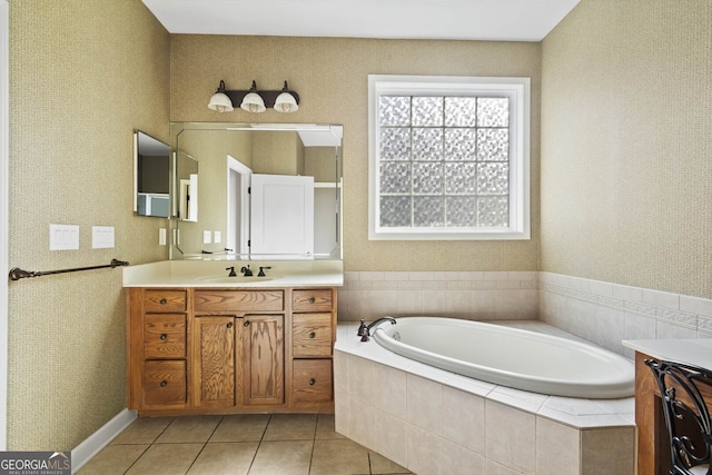 bathroom featuring a bath, tile patterned flooring, vanity, and wallpapered walls