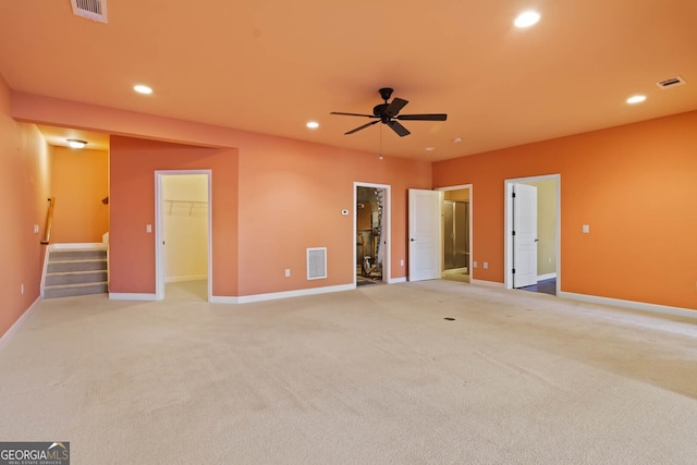 unfurnished room featuring recessed lighting, visible vents, and stairs