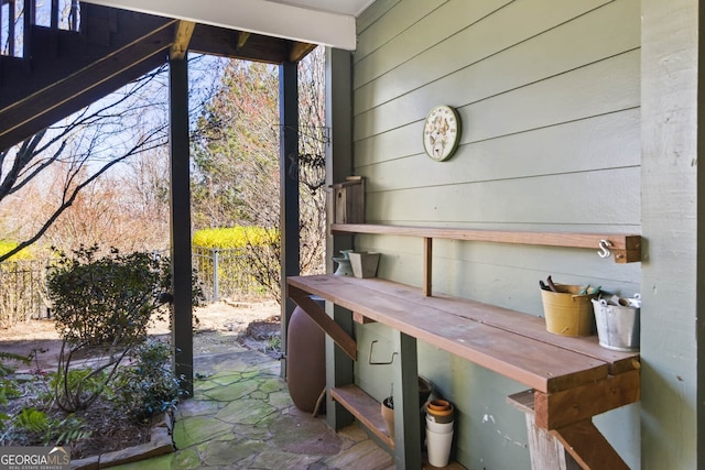 view of patio / terrace featuring fence