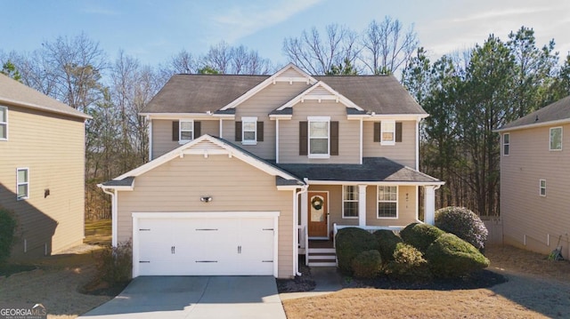 view of front of property featuring concrete driveway and an attached garage