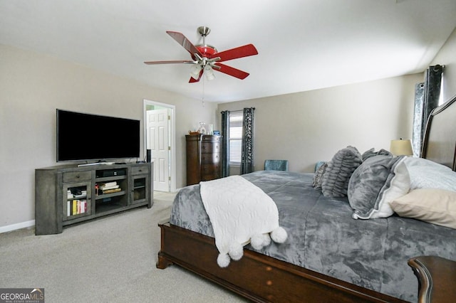 carpeted bedroom featuring a ceiling fan and baseboards