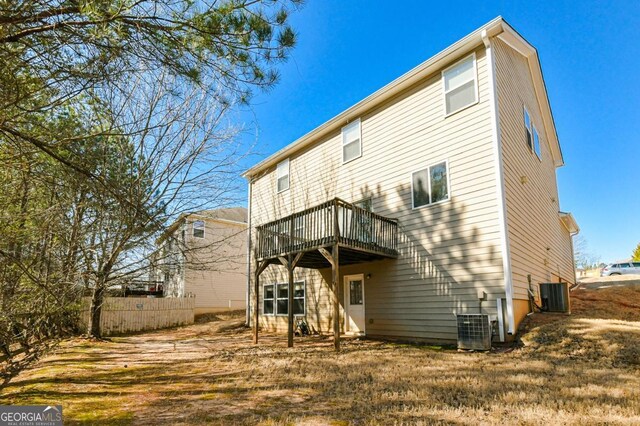 back of house with central AC