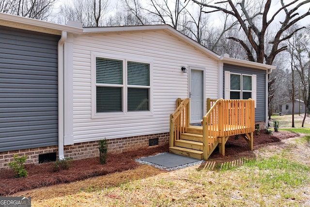 doorway to property with crawl space