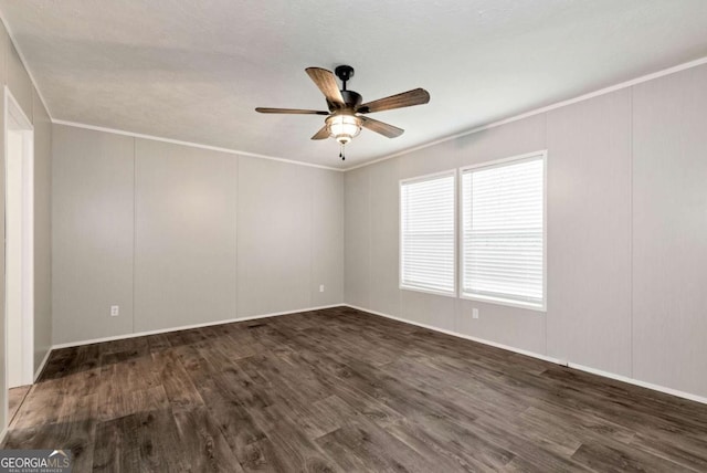 unfurnished room featuring dark wood-type flooring, crown molding, and a ceiling fan