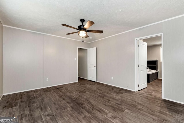 unfurnished bedroom with a textured ceiling, wood finished floors, and crown molding