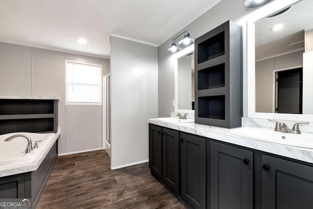 full bath with double vanity, ornamental molding, and a sink