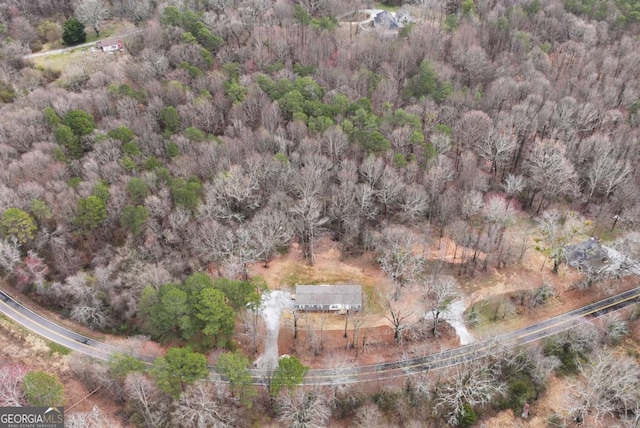 drone / aerial view featuring a view of trees