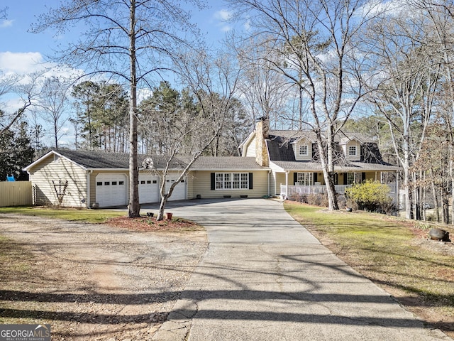 cape cod home featuring fence, a porch, a chimney, driveway, and an attached garage