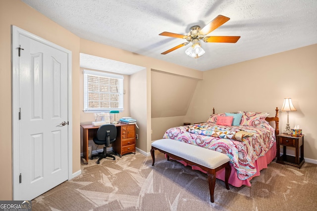 bedroom with baseboards, carpet, a ceiling fan, and a textured ceiling