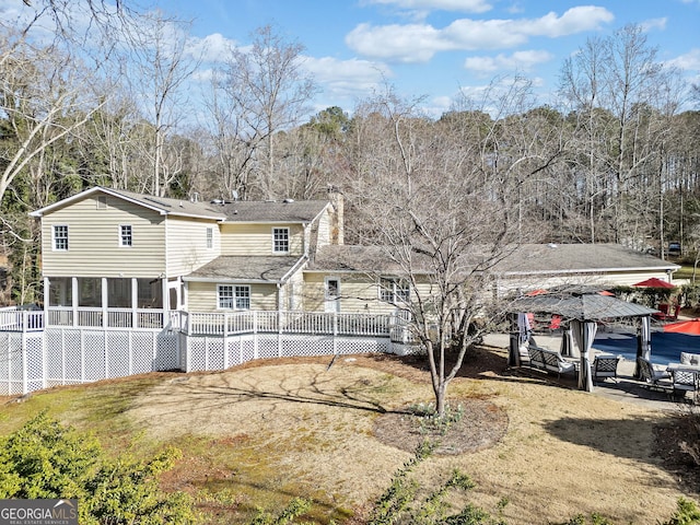 view of front facade with a wooden deck