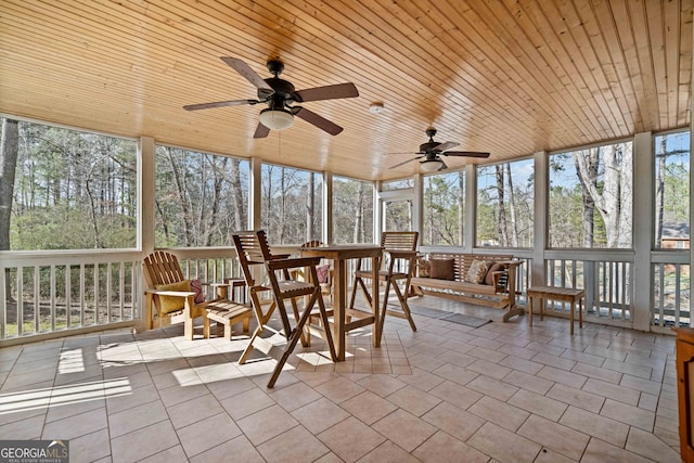 unfurnished sunroom featuring wood ceiling