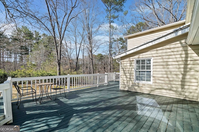 deck featuring a view of trees