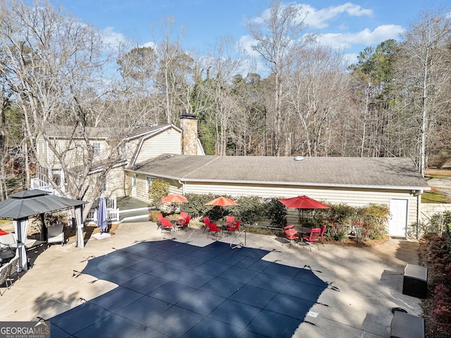 exterior space with a gazebo and a patio