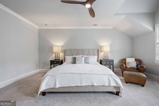 carpeted bedroom with visible vents, ceiling fan, baseboards, and vaulted ceiling