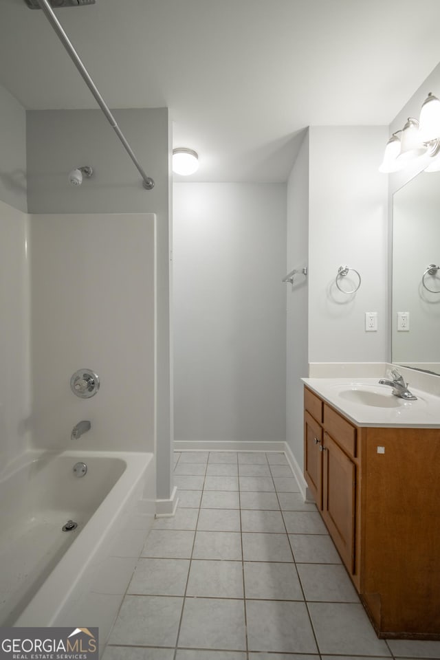 bathroom featuring baseboards, shower / washtub combination, vanity, and tile patterned floors