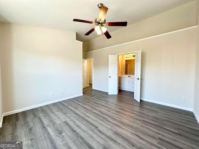 unfurnished bedroom with wood finished floors, a ceiling fan, and baseboards