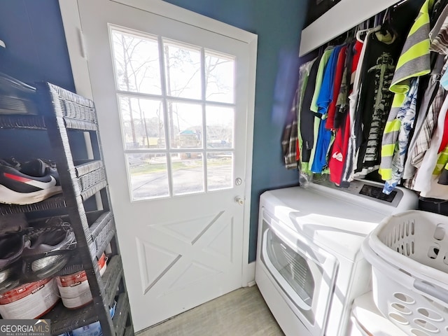 washroom featuring laundry area and washer and clothes dryer