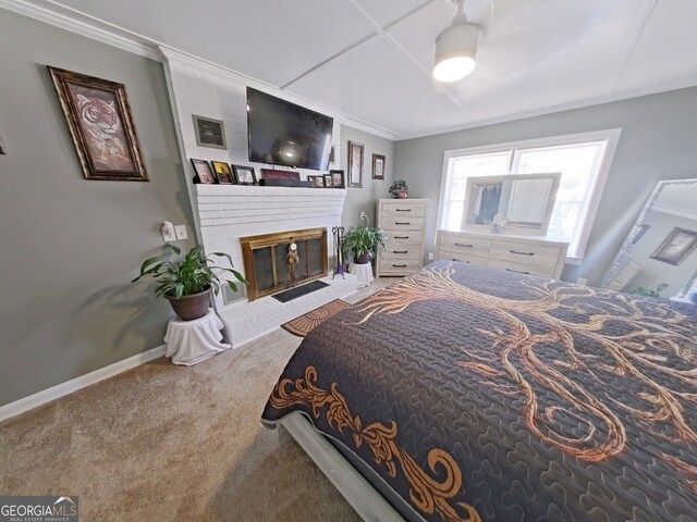 bedroom with a fireplace, visible vents, baseboards, carpet, and crown molding